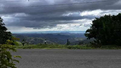 an empty road with a view of the mountains at Casa Vegas Panoramic Views near Monteverde in Turín