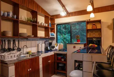a kitchen with a sink and a refrigerator at Casa Vegas Panoramic Views near Monteverde in Turín