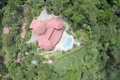 an overhead view of a house with a pink roof at 3BR, Spectacular Jungle Villa w Waterfalls & Toucans in Barú