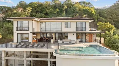 an aerial view of a house with a swimming pool at Villa Costa Sota - Ocean View & Pickleball Courts in Coco