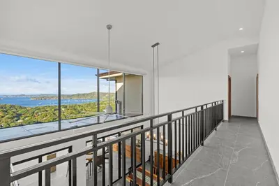 an apartment balcony with a view of the water at Villa Costa Sota - Ocean View & Pickleball Courts in Coco