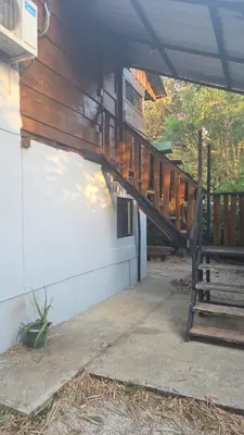 a wooden staircase leading up to a house at Casa Passiflora - Playa Grande in Refundores