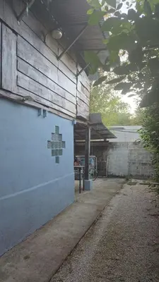 a building with a painting on the side of it at Casa Passiflora - Playa Grande in Refundores