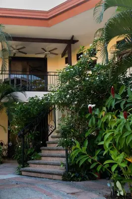a staircase leading up to a house with plants at Corteza 2BD Gated AC Quiet Terrace Pools in Jacó