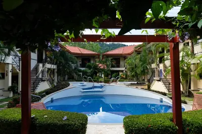 a swimming pool in front of a house at Corteza 2BD Gated AC Quiet Terrace Pools in Jacó