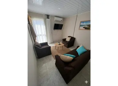 a living room with a couch and a table at Casas de Playa en Familia