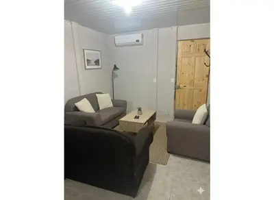 a living room with a couch and a table at Casas de Playa en Familia