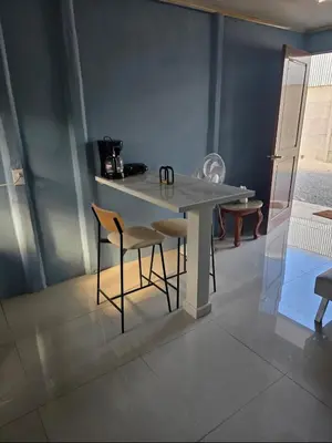 a dining table and chairs in a room at Apartamento DesCANsO #2 in Comunidad