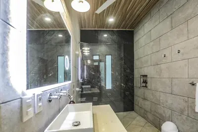 a bathroom with a sink and a shower at The Retreat Uvita in Uvita