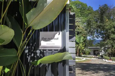 a sign on the side of a building at The Retreat Uvita in Uvita