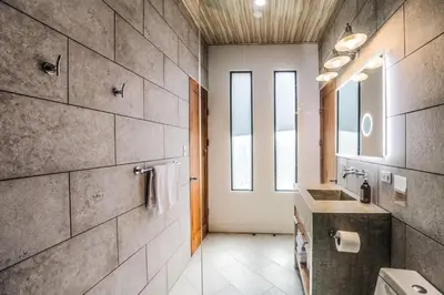 a bathroom with a sink and a mirror at The Retreat Uvita in Uvita