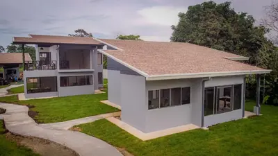 a rendering of a house with a yard at Villa Elemental Modern Villa Volcano Views & Luxe Touches in Fortuna