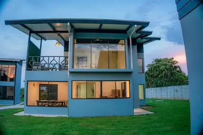 a large house with a roof on top of it at Villa Sunset Relaxing 2BR Villa with Outdoor Hot Tub in Fortuna