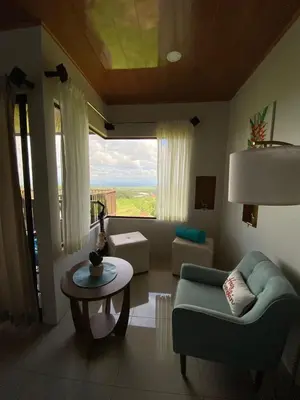 a living room with a couch and a table at Villa Paraiso in Colonia
