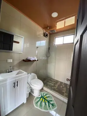 a small bathroom with a toilet and a sink at Villa Paraiso in Colonia