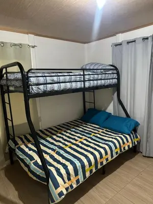 a bunk bed in a small room with a bunk bedscribed at Villa Elena Vacation Home in Nicoya