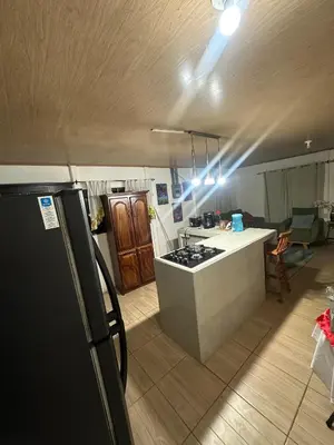 a kitchen with a stove and a counter top at Villa Elena Vacation Home in Nicoya