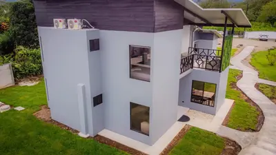 an overhead view of a white house with a balcony at Villa Sundrop Villa for 8 with Volcano Views & Family Comfort in Fortuna