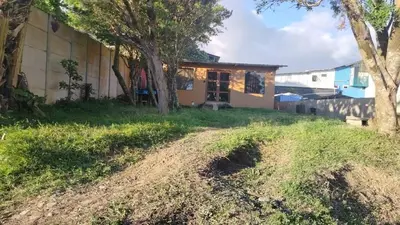 a house with a dirt road in front of it at Apartamento Norte y Sur in Monteverde Costa Rica