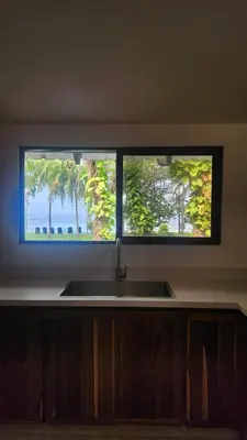 a kitchen sink and a window with a view of the ocean at Casa Descanso del Pescador in Garza