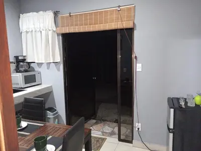 a room with a black door with a window at Yamis home in General Viejo