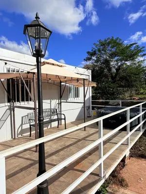 a street light sitting next to a white fence at Cabinas Diana in San José Pinilla