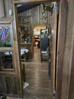 a hallway of a room with wooden floors and a door at Landscape-Cabaña winter full equipada in La Cruz