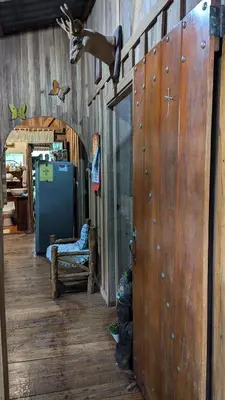 a room with a wooden wall and a wooden floor at Landscape-Cabaña winter full equipada in La Cruz