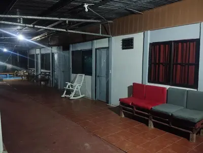 a room with a red bench in a building at Casa Abbi in Cuajiniquil