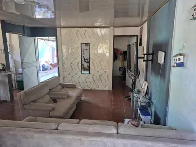a living room with a couch and a living room at Casa Abbi in Cuajiniquil
