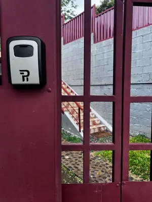 a door with a parking meter on it next to a stairs at Casa Girasol PZ in San Isidro