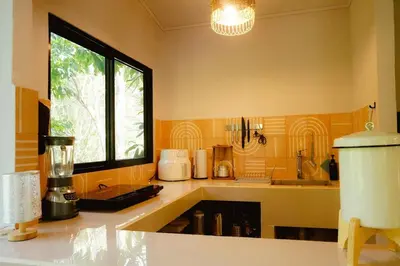a kitchen with a sink and a window and a counter at Ital Mountain modern hideaway with tropical vibes in Mal País