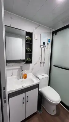 a bathroom with a white sink and a toilet at Casa Loma del Lago - Lake Arenal View in Tilarán