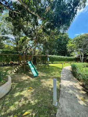 a playground with a slide in a park at Casa Duna in Herradura