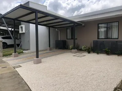 a house with a pavilion in front of it at Casa Duna in Herradura