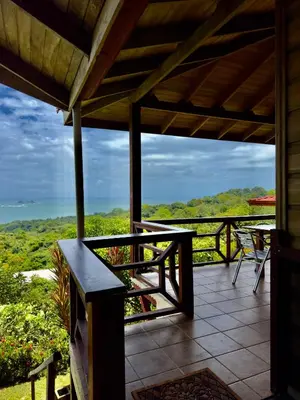 a porch of a house with a view of the ocean at Manys house in Ballena