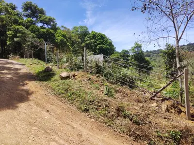 a fence on the side of a dirt road at Mount & Wood in San Marcos