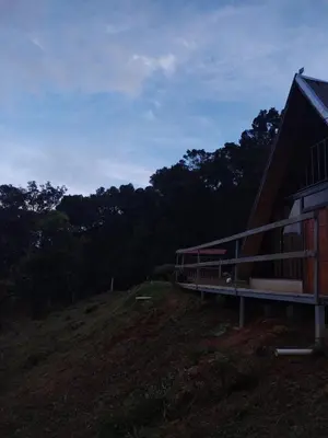a building on top of a hill with trees at Mount & Wood in San Marcos