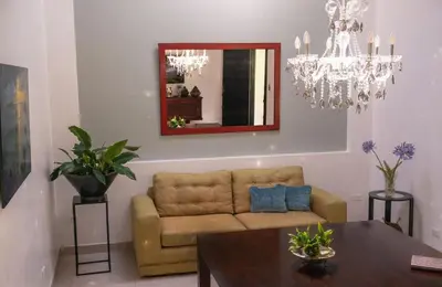 a living room with a couch and a table at Green villa in La Asunción