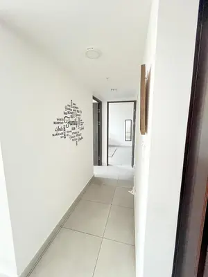 a hallway with a white wall with a heart on the wall at Apartamento en San Pablo, Heredia, Costa Rica in San Pablo