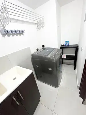 a bathroom with a large appliance in the corner of a room at Apartamento en San Pablo, Heredia, Costa Rica in San Pablo