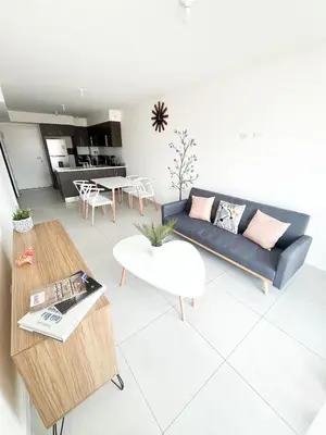 a living room with a couch and a table at Apartamento en San Pablo, Heredia, Costa Rica in San Pablo