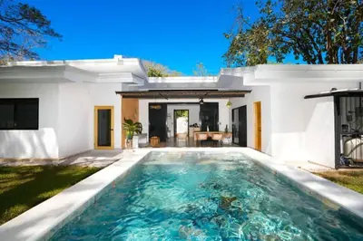 a swimming pool in the backyard of a house at Casa Abana in Sámara