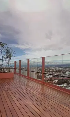 a balcony with a view of a city at Apartamento Moderno con Vista Piscina Infinita Secrt Escalante in San Pedro
