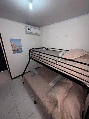 a bedroom with a bunk bed in a room at Private House with Pool 10 min from Playa Sámara in Nicoya