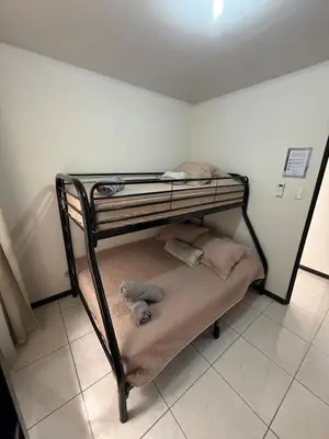 a bunk bed with a teddy bear on the bottom bunk at Private House with Pool 10 min from Playa Sámara in Nicoya