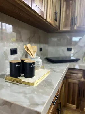 a kitchen counter with two coffee cups and utensils at Pura Tropic Lodge in Guayabal