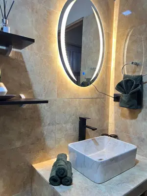a bathroom with a sink and a mirror at Pura Tropic Lodge in Guayabal