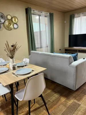 a living room with a couch and a table at Pura Tropic Lodge in Guayabal