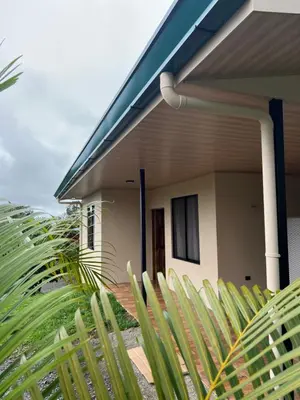 a house with a fence in front of it at Pura Tropic Lodge in Guayabal